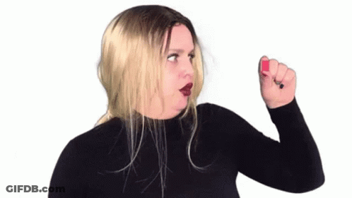 Woman In Black Turtleneck Holding Red Nail Polish GIF