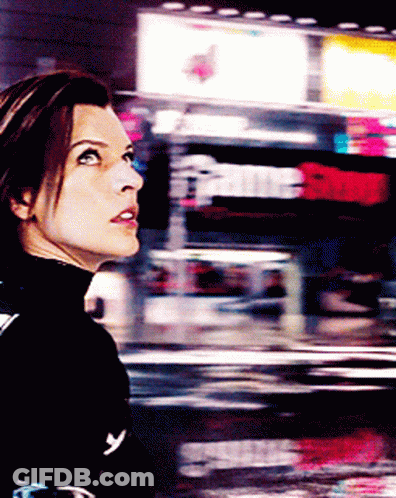 Woman In Black Turtleneck Looking Up GIF