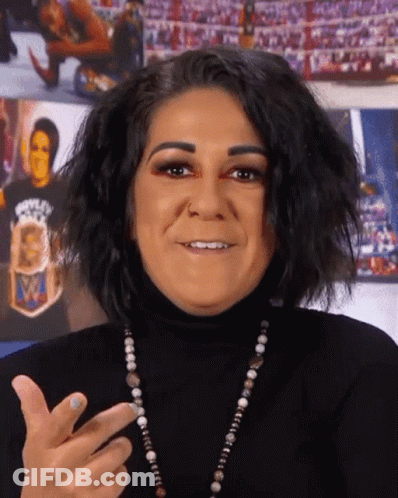 Woman In Black Turtleneck Smiling Making Funny Face GIF