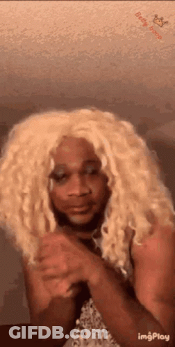 Woman In Blonde Wig Making Funny Face GIF