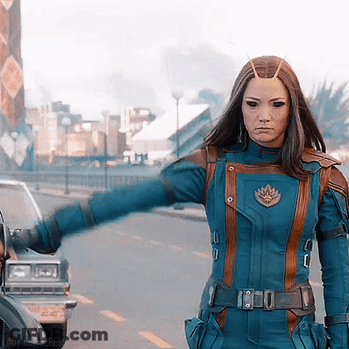 Woman In Blue And Brown Superhero Costume GIF