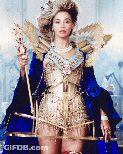 Woman In Blue And Gold Costume Holding Scepter GIF