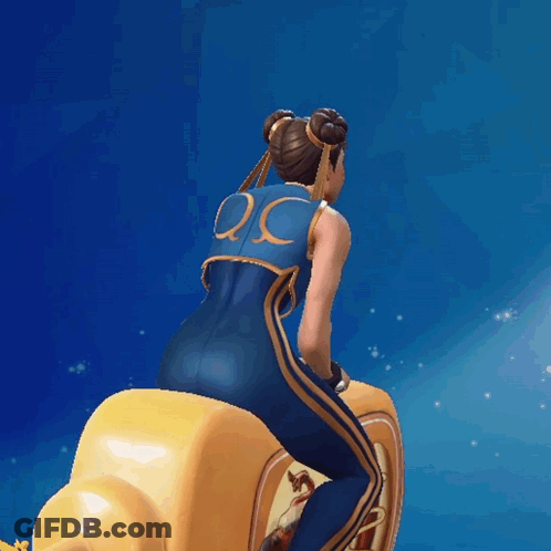 Woman In Blue And Gold Outfit Riding Yellow Object GIF