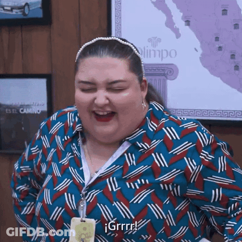 Woman In Blue And Red Shirt Laughing With Eyes Closed In Front Of Map GIF