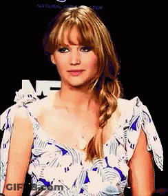Woman In Blue And White Dress With Braided Ponytail GIF