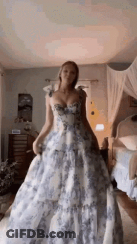 Woman In Blue And White Floral Dress GIF