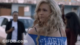 Woman In Blue And White Florida Shirt In Parking Lot GIF
