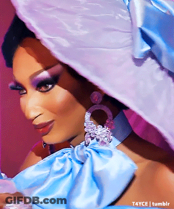 Woman In Blue And White Hat And Earrings GIF