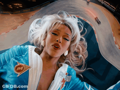 Woman In Blue And White Jacket With Letter M GIF