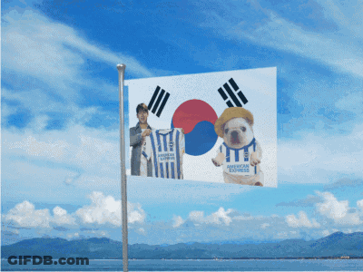 Woman In Blue And White Striped American Express Jersey Smiling GIF
