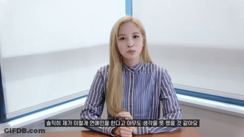Woman In Blue And White Striped Shirt At Desk GIF