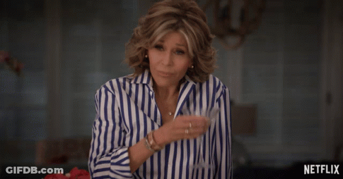 Woman In Blue And White Striped Shirt By Netflix Sign GIF
