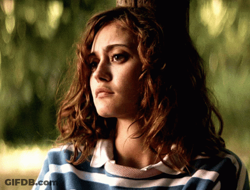 Woman In Blue And White Striped Shirt Looks Sad GIF