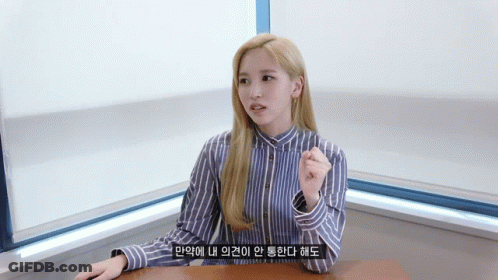 Woman In Blue And White Striped Shirt Sitting GIF