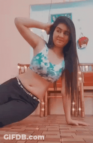 Woman In Blue And White Top Doing Push Ups GIF