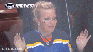 Woman In Blue And Yellow Jersey With Fox Midwest Logo GIF