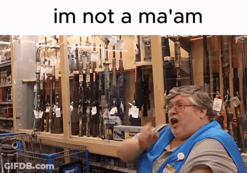 Woman In Blue Apron In Front Of Guns Saying Im Not A Ma GIF