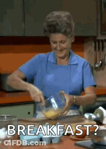 Woman In Blue Apron Preparing Food GIF