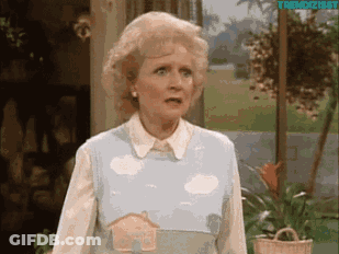 Woman In Blue Apron With House GIF