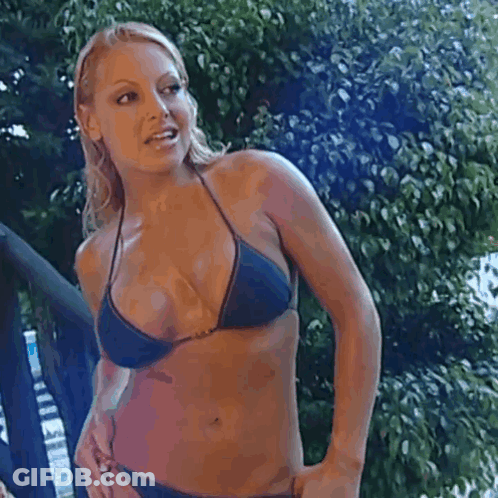 Woman In Blue Bikini Standing In Front Of Tree GIF