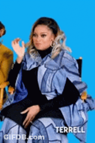 Woman In Blue Cape Making Funny Face GIF