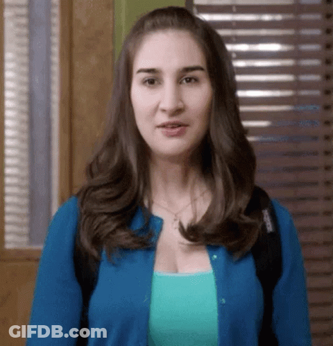 Woman In Blue Cardigan And Blue Shirt GIF