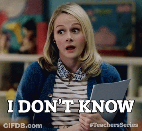 Woman In Blue Cardigan Saying I Don't Know GIF