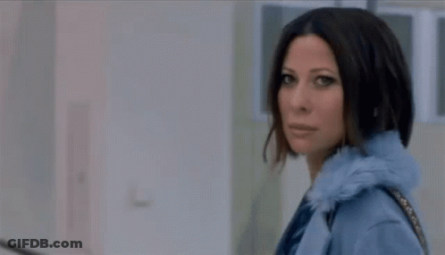 Woman In Blue Coat Walking With Purse GIF
