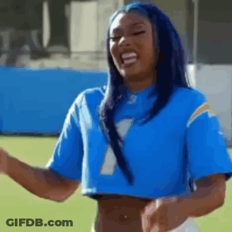 Woman In Blue Crop Top And Football Jersey GIF