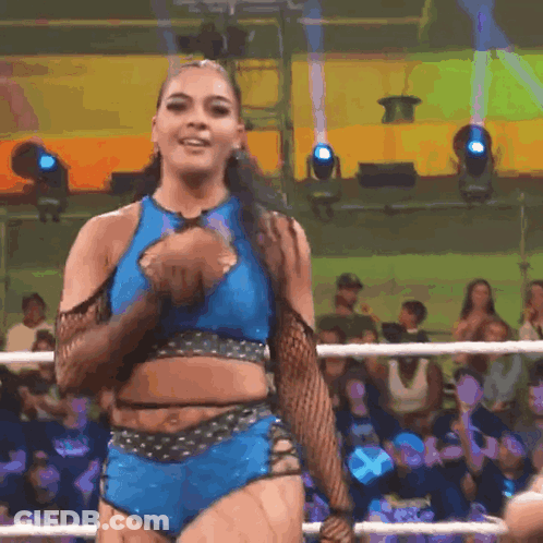 Woman In Blue Crop Top And Shorts In Wrestling Ring GIF