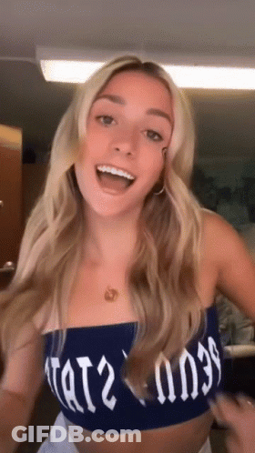 Woman In Blue Crop Top Saying Tat2 GIF