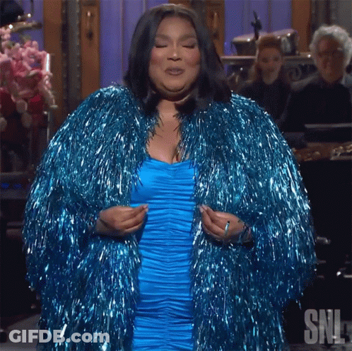 Woman In Blue Dress And Blue Tinsel Coat GIF
