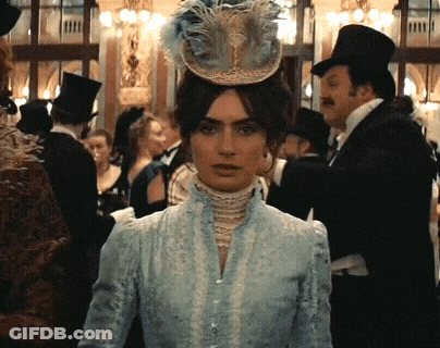 Woman In Blue Dress And Feathered Hat GIF