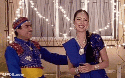 Woman In Blue Dress And Man By Window GIF