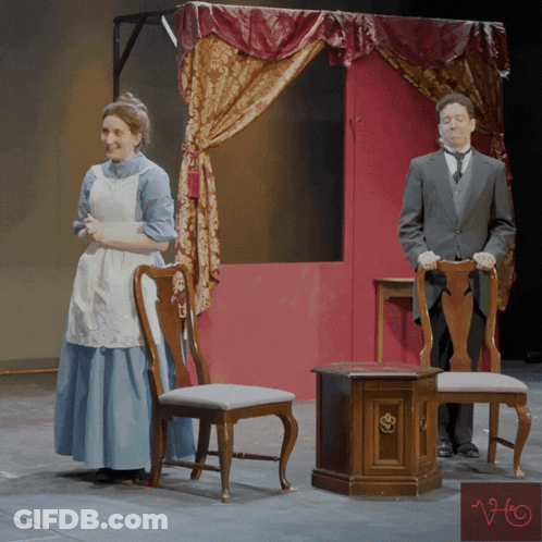 Woman In Blue Dress And Man In Suit Under Canopy GIF
