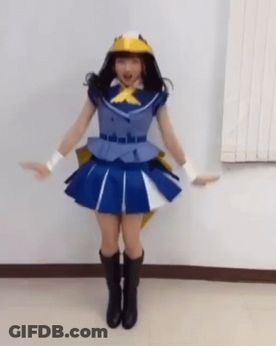 Woman In Blue Dress And Yellow Hat With Arms Outstretched GIF