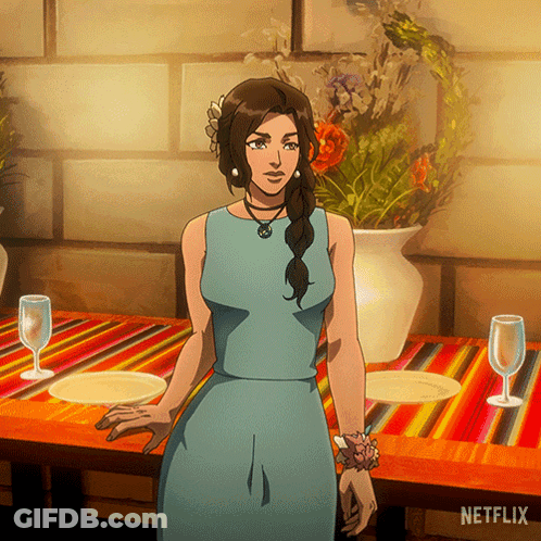 Woman In Blue Dress At Table With Netflix Logo GIF