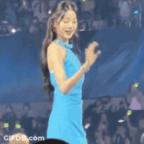 Woman In Blue Dress Clapping Before Crowd GIF