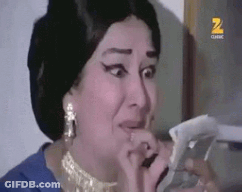 Woman In Blue Dress Crying Holding Paper GIF