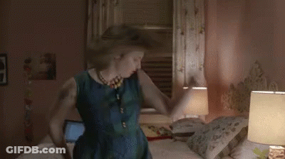 Woman In Blue Dress Dancing In Bedroom GIF