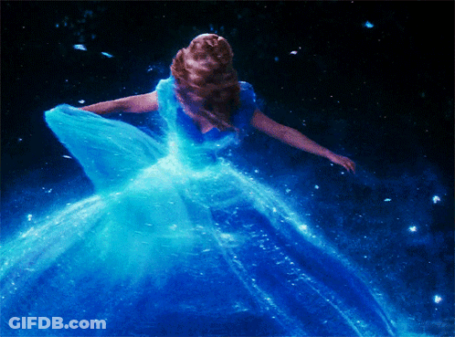 Woman In Blue Dress Dancing In Dark GIF