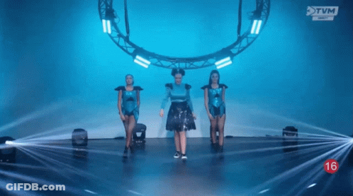 Woman In Blue Dress Dancing On Stage GIF