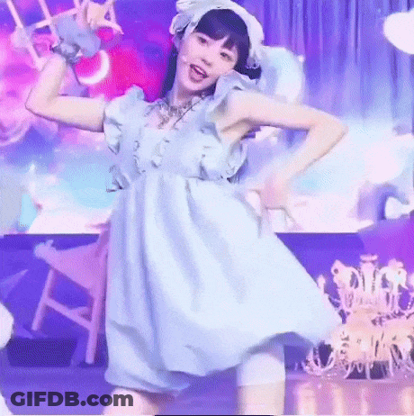 Woman In Blue Dress Dancing On Stage With Chandelier GIF