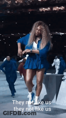 Woman In Blue Dress Dancing With Text GIF
