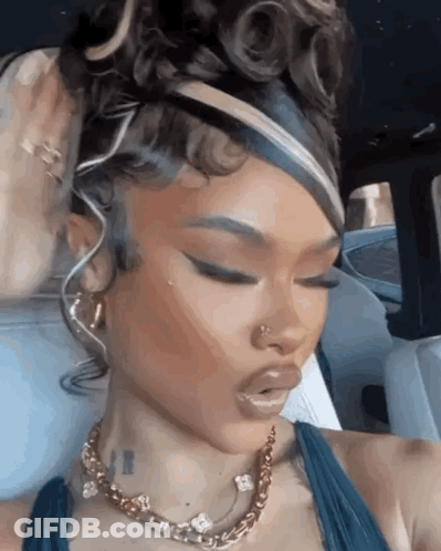 Woman In Blue Dress Eyes Closed In Car GIF