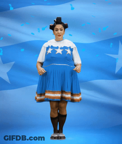Woman In Blue Dress Holding Banner Saying Felices Fies GIF