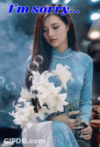 Woman In Blue Dress Holding Flowers Saying I'm Sorry GIF