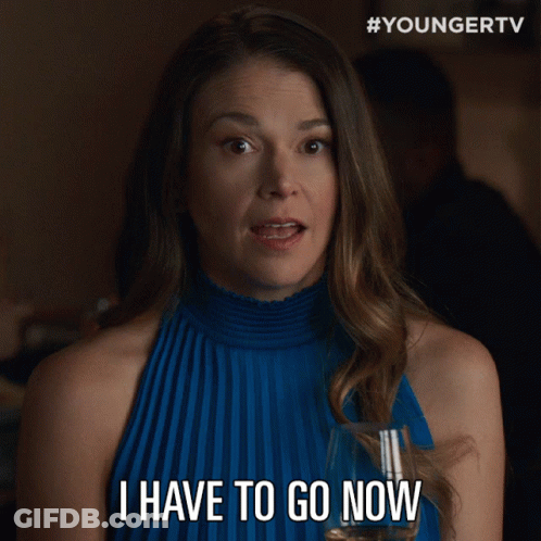 Woman In Blue Dress Holding Glass Saying I Have To Go Now GIF