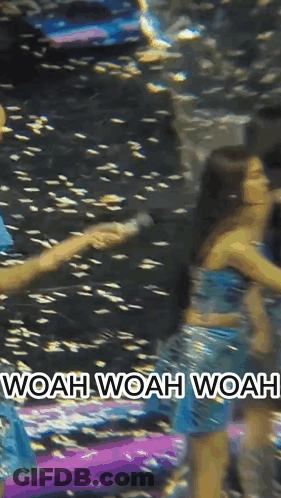 Woman In Blue Dress Holding Hand Saying Woah Woah Woah GIF