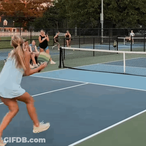 Woman In Blue Dress Holding Tennis Racquet GIF